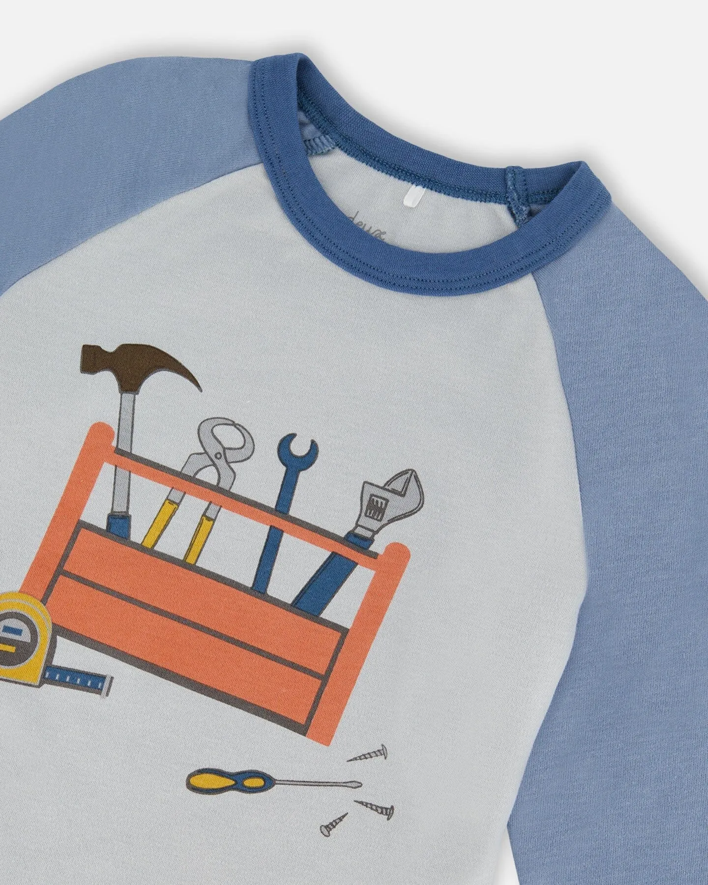 Organic Cotton Long Sleeve Top And Pants Two-Piece Pajama Set Tools On Bluish Gray Background