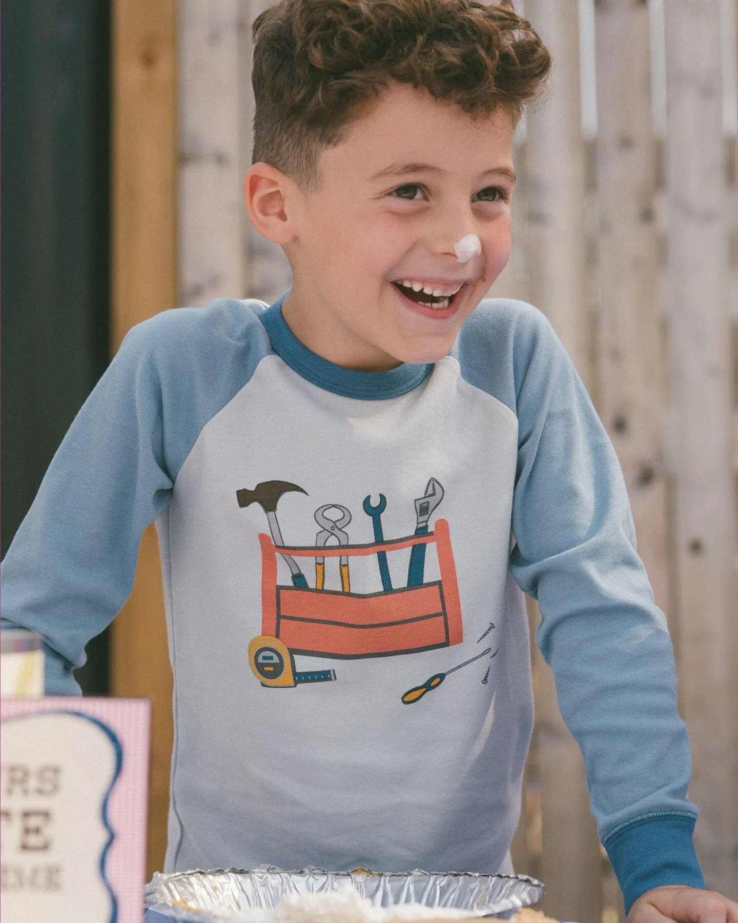 Organic Cotton Long Sleeve Top And Pants Two-Piece Pajama Set Tools On Bluish Gray Background
