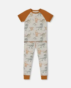 Organic Cotton Two-Piece Short Sleeve Top And Pant Pajama Set Dinosaur On Mottled And Tan Background
